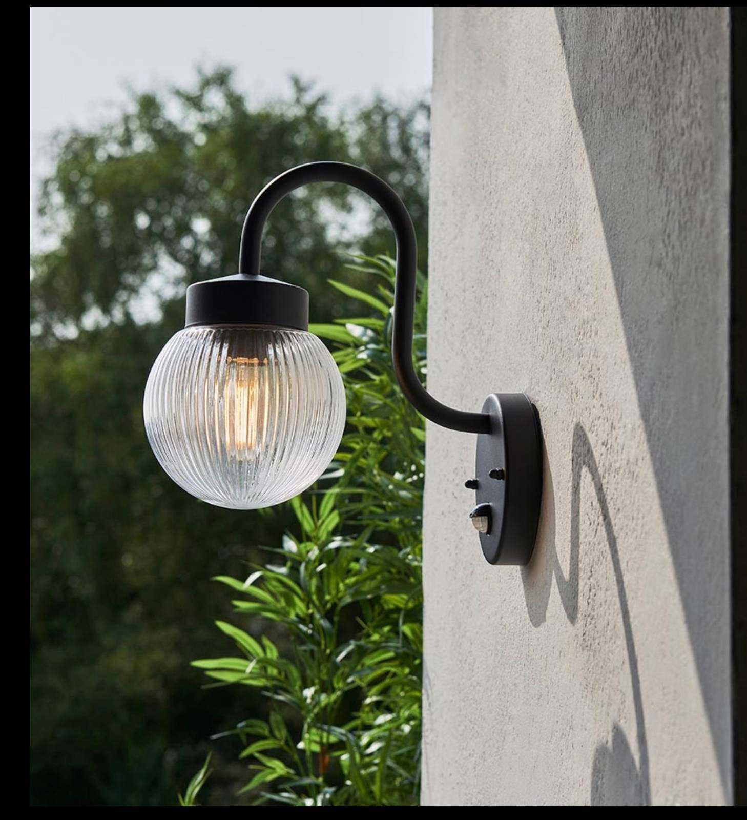 Eldon outdoor Wall PIR sensor light / exterior black and ribbed glass lamp