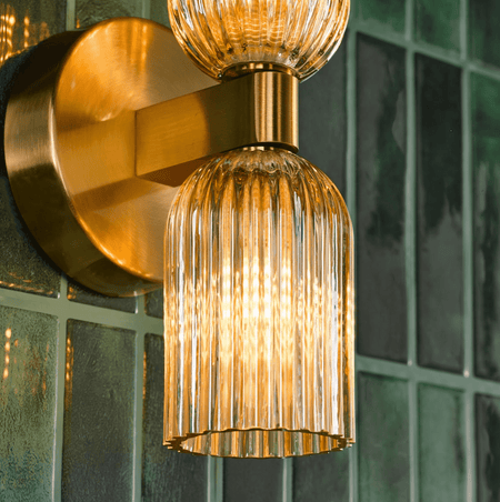 Hilaria 2 Light Bathroom Wall Light Antique Gold and Amber Ribbed Glass IP44