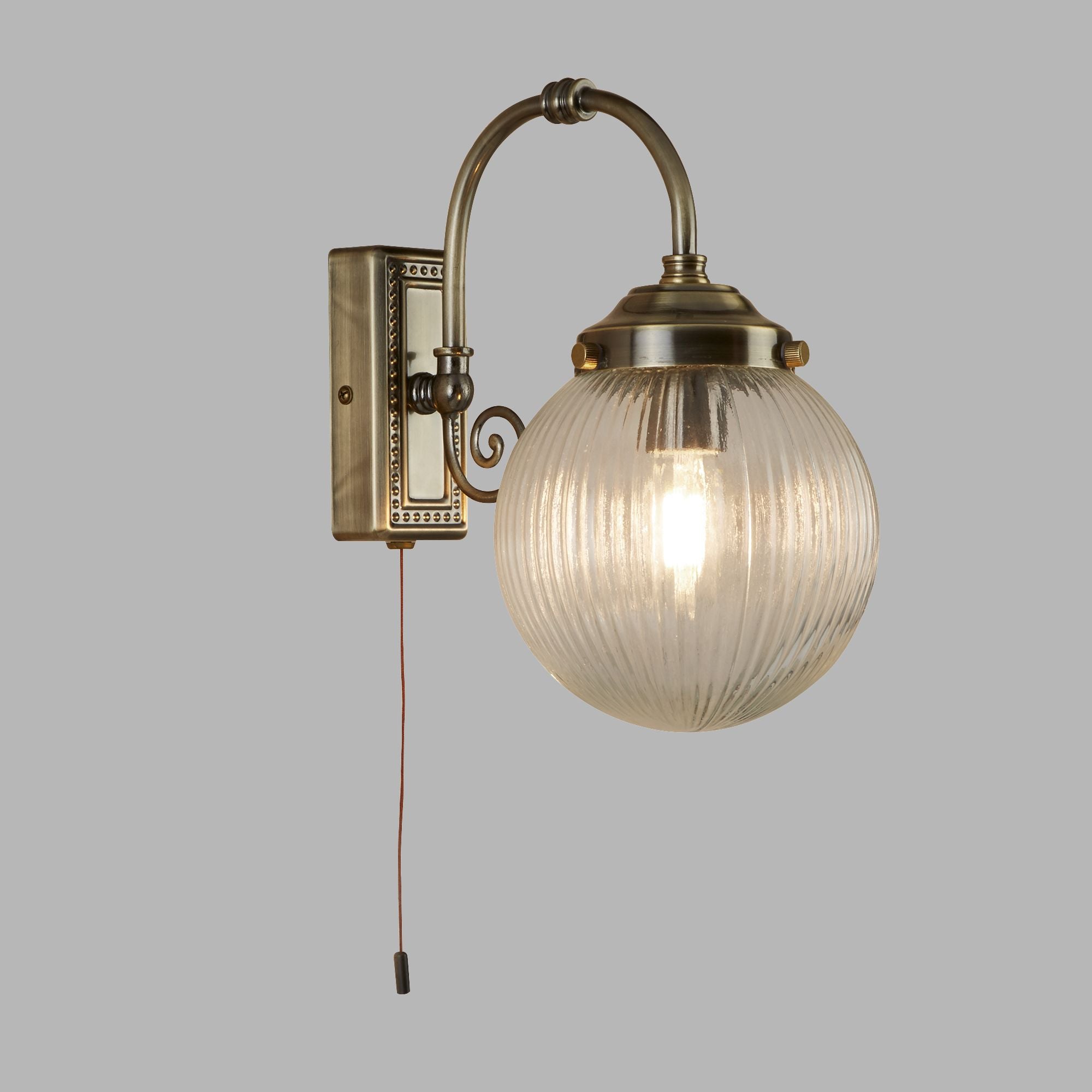 Belvue 1Lt Bathroom Ip44 Wall Light, Clear Globe Shade, Antique Brass